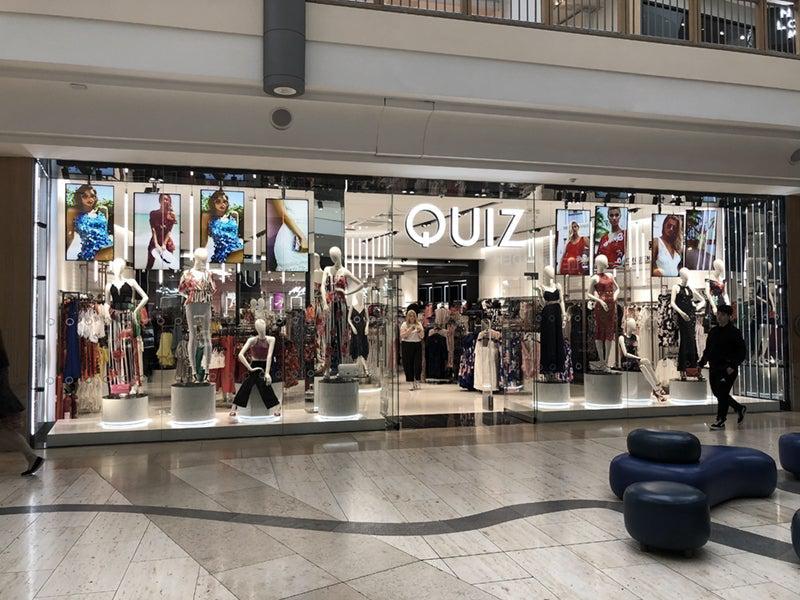 Professional Monitors on ceiling mount in retail store