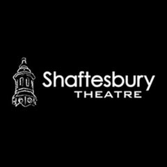 Logo of Shaftesbury Theatre with a clock tower illustration on a black background