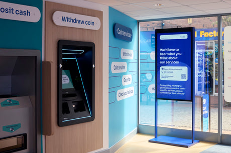 ATM machine with digital display inside a bank branch