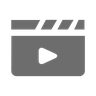 Gray icon of a video play button on a white background
